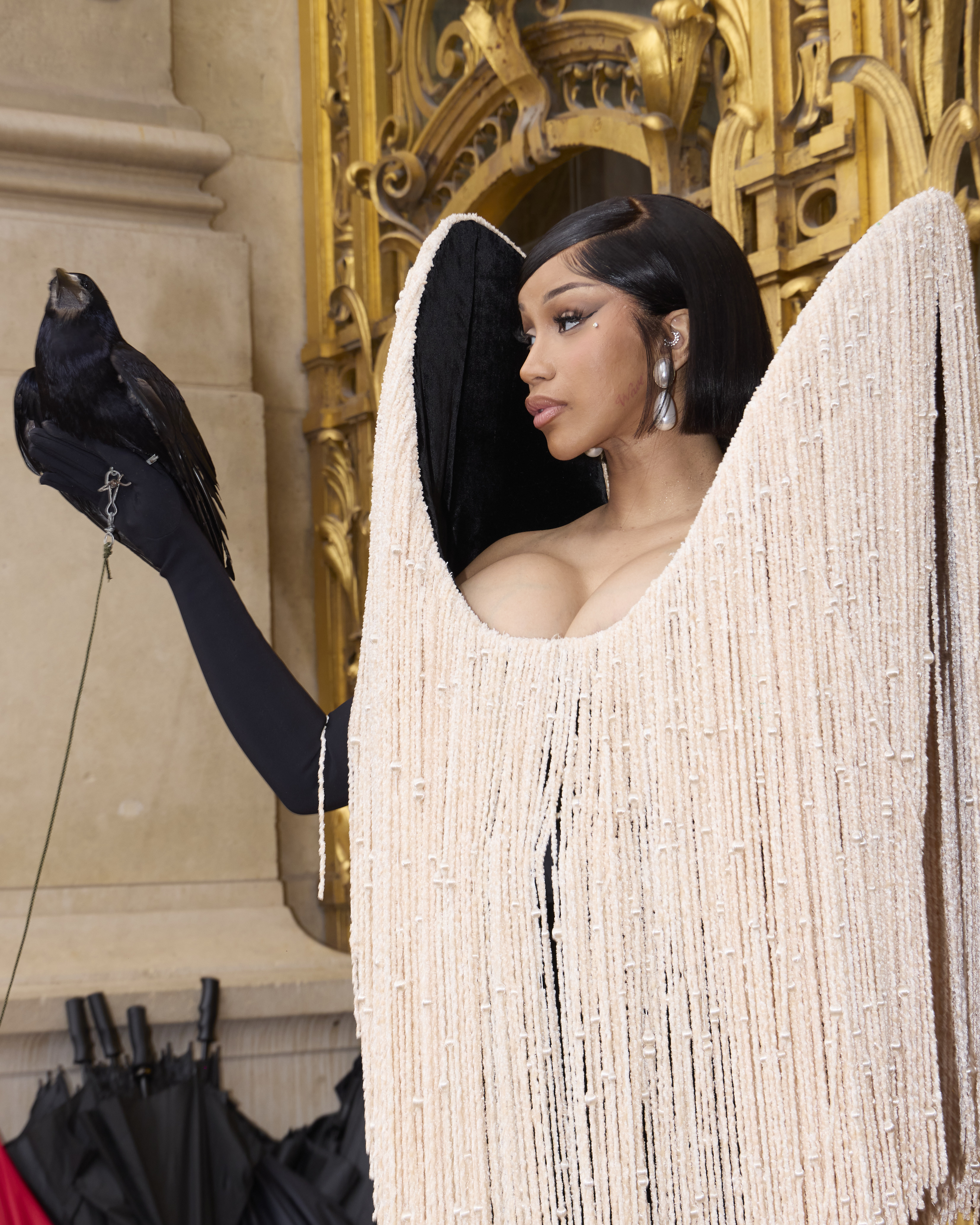 Cardi B brings the drama with live crow and miles of fringe at Schiaparelli show in Paris